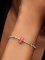 Sterling silver charm with clear cubic zirconia and imitation coral