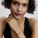 14k gold-plated clip with clear cubic zirconia and silicone grip