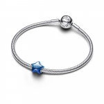 Puffy star sterling silver charm with blue enamel
