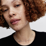 Bow sterling silver station chain necklace with clear cubic zirconia and sliding clasp