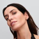 Infinity knot sterling silver stud earrings with pink lacquered artificial pearl and clear cubic zirconia