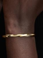 Twisted 14k gold-plated open bangle