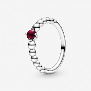 Sterling silver ring with dark red crystal