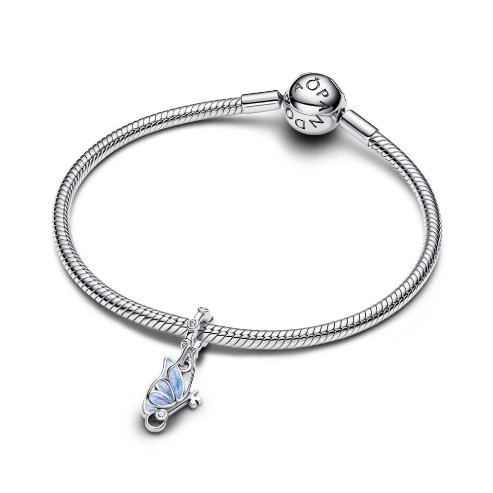 Winged key sterling silver dangle with clear cubic zirconia and shimmering blue enamel Winged key sterling silver dangle with clear cubic zirconia and shimmering blue enamel