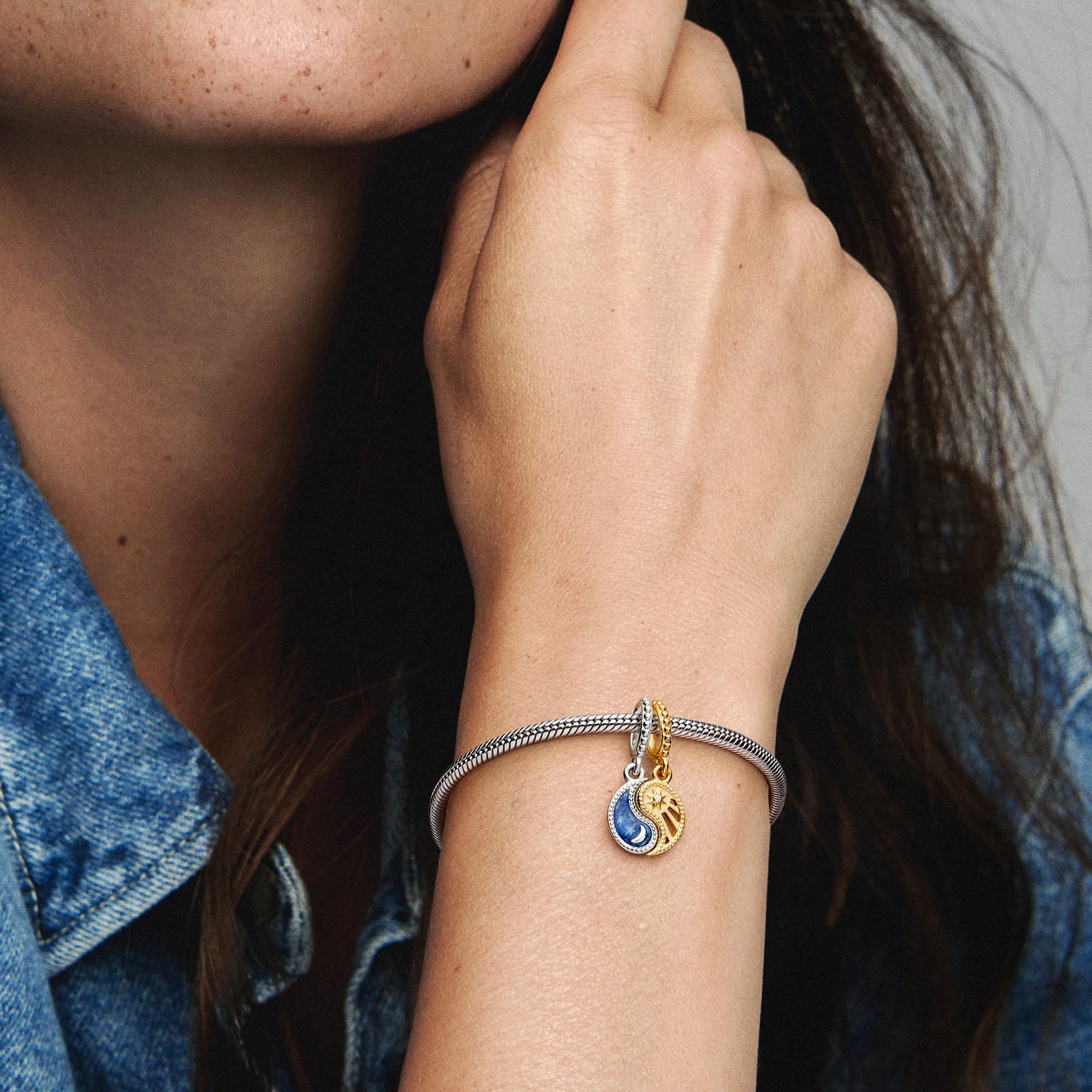 Yin and Yang sterling silver and 14k gold-plated splittable dangle with clear cubic zirconia and glittering shaded blue enamel Yin and Yang sterling silver and 14k gold-plated splittable dangle with clear cubic zirconia and glittering shaded blue enamel
