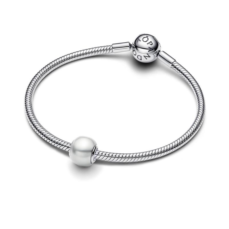 Sterling silver charm with white lacquered artificial pearl