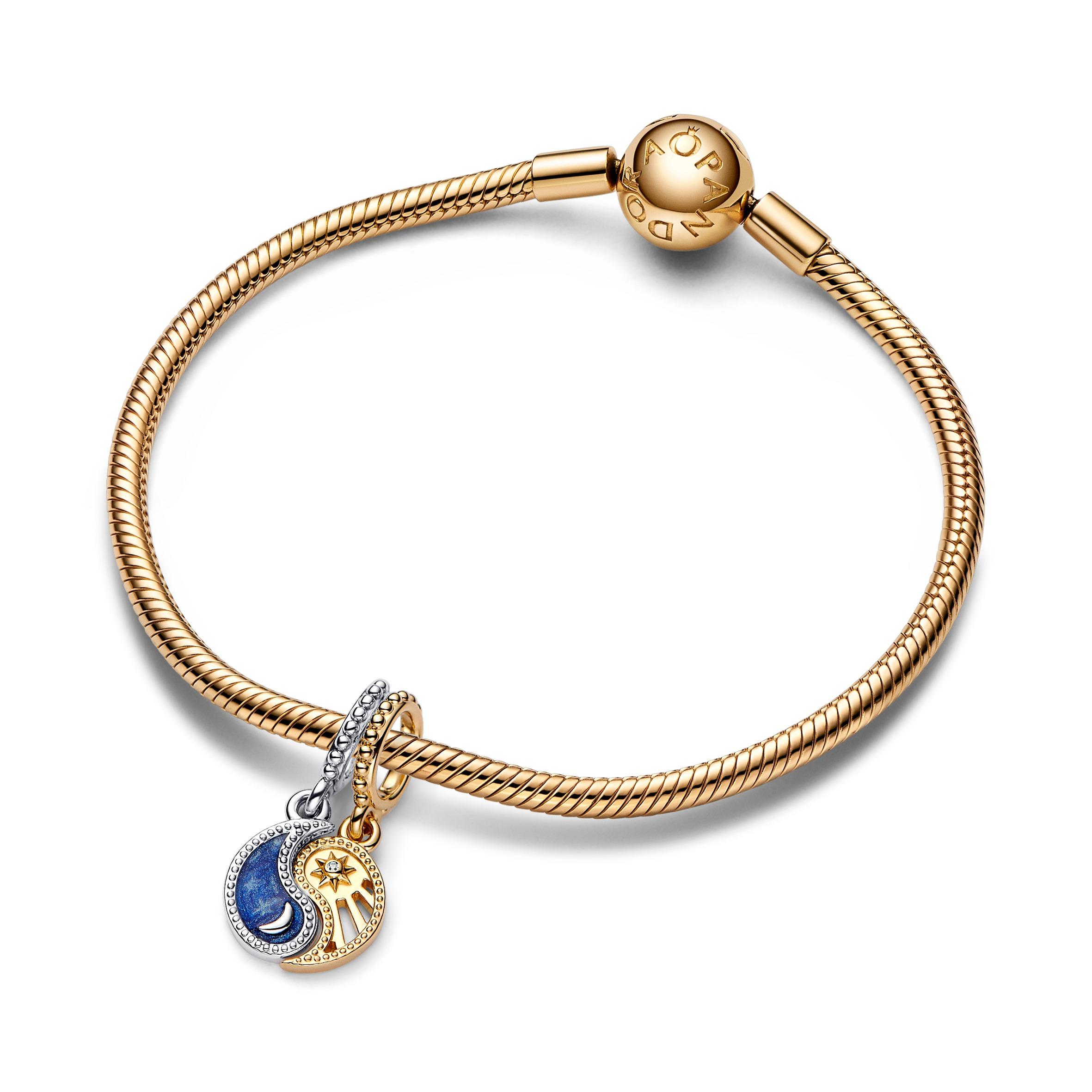 Yin and Yang sterling silver and 14k gold-plated splittable dangle with clear cubic zirconia and glittering shaded blue enamel Yin and Yang sterling silver and 14k gold-plated splittable dangle with clear cubic zirconia and glittering shaded blue enamel