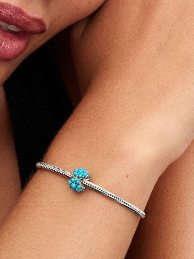 Sterling silver charm with clear cubic zirconia and imitation turquoise