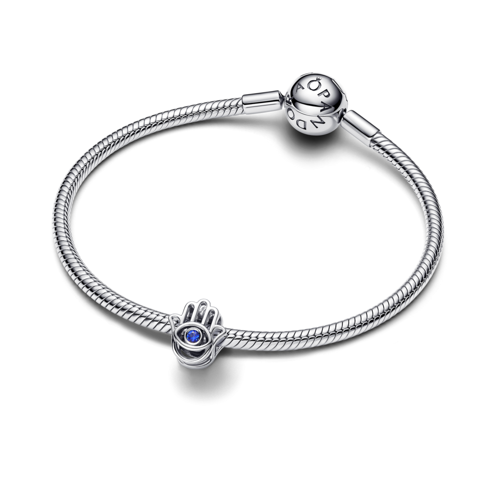 Hamsa hand sterling silver charm with stellar blue crystal Hamsa hand sterling silver charm with stellar blue crystal