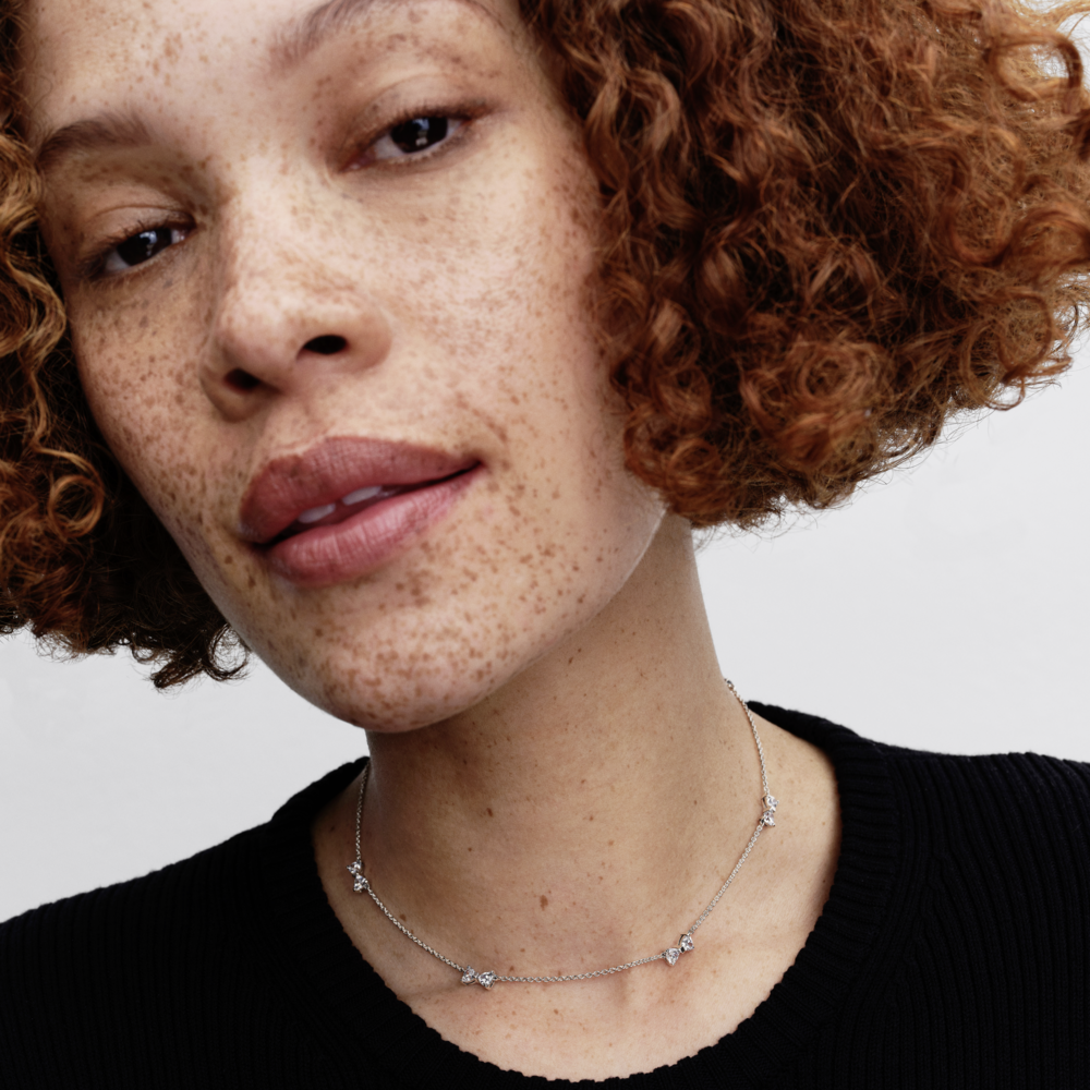 Bow sterling silver station chain necklace with clear cubic zirconia and sliding clasp Bow sterling silver station chain necklace with clear cubic zirconia and sliding clasp