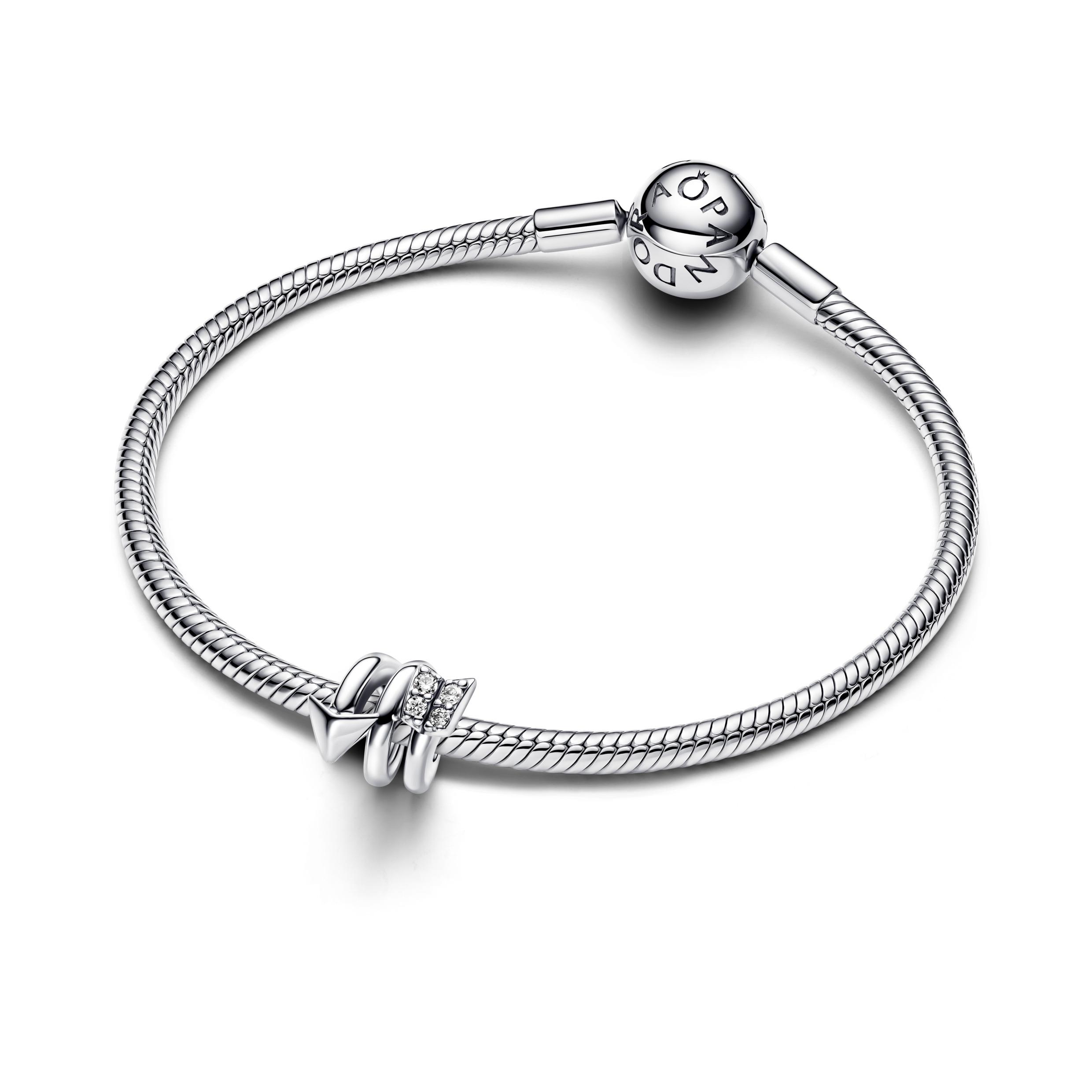 Twisting arrow sterling silver charm with clear cubic zirconia