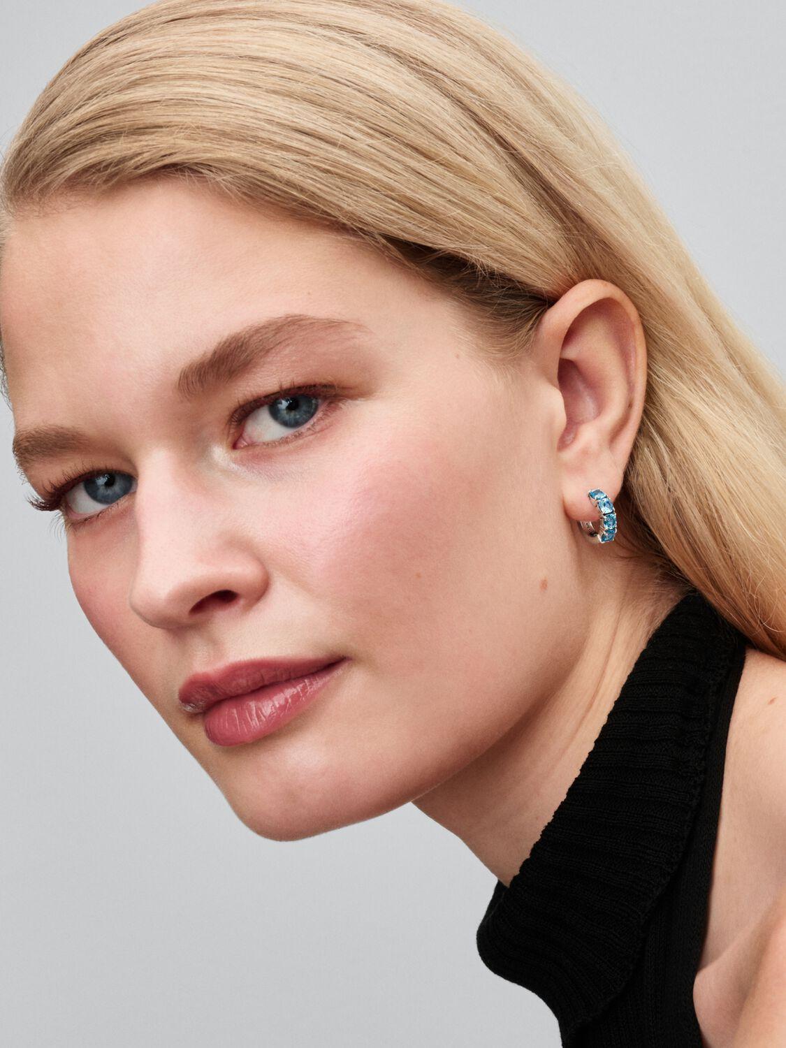 Sterling silver hoop earrings with aquamarine blue crystal
