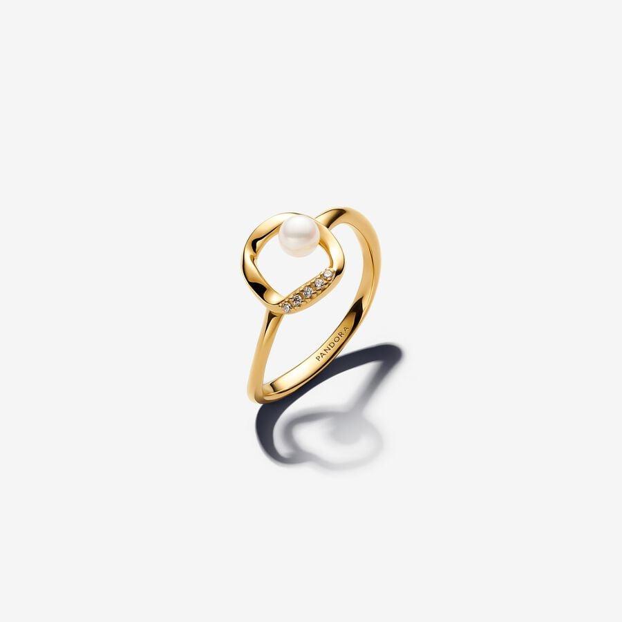 14k gold-plated ring with treated white freshwater cultured pearl and clear cubic zirconia