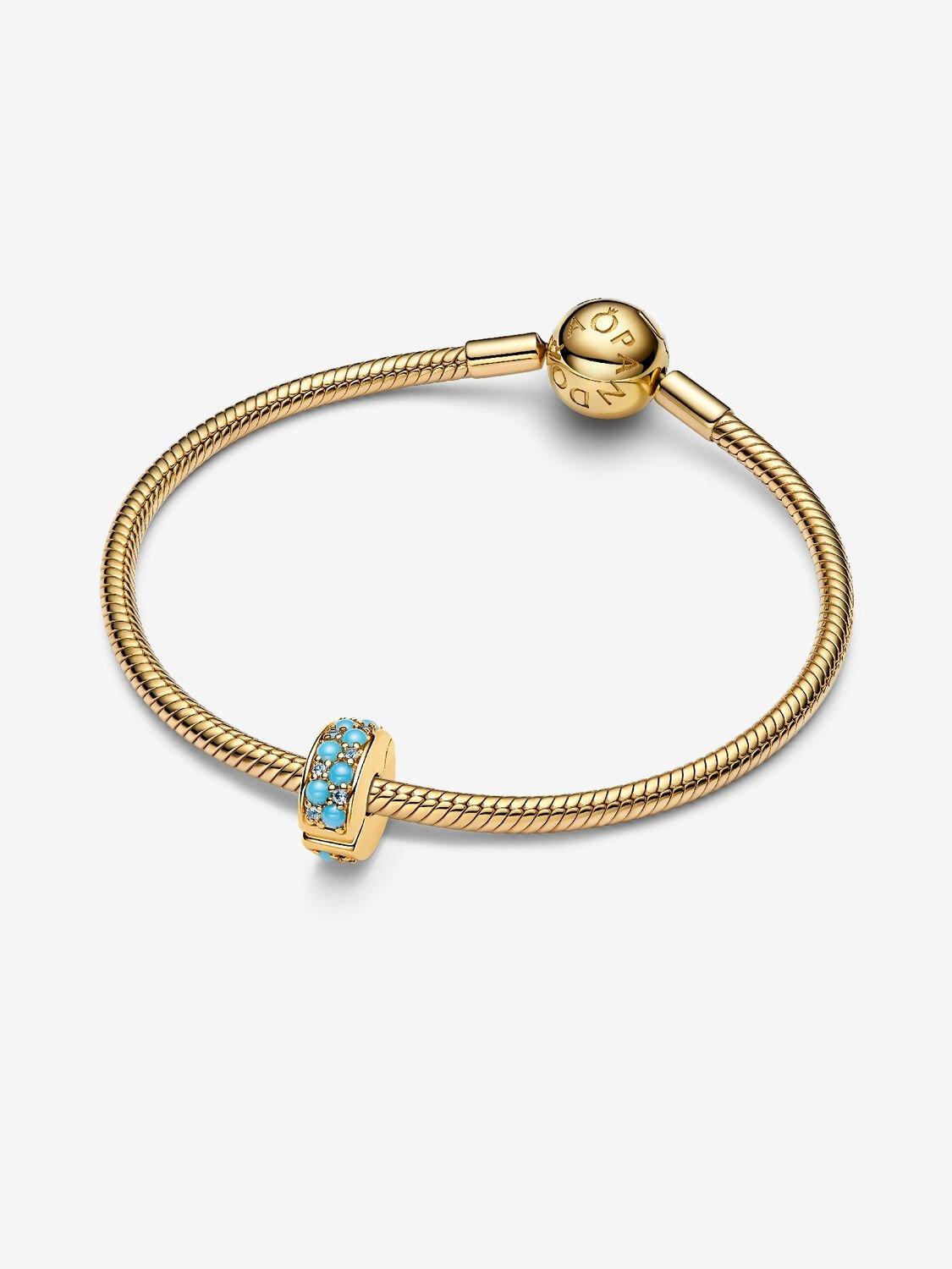 14k gold-plated clip with icy blue and capri blue crystal and silicone grip